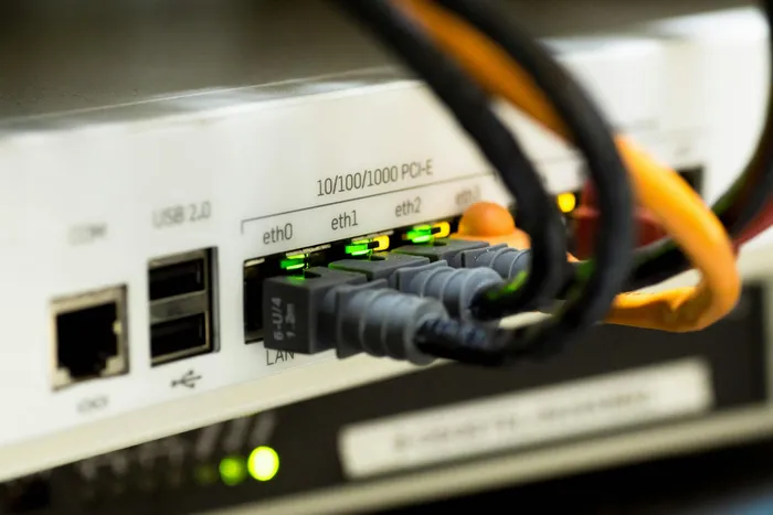 Close-up of a network device showing multiple Ethernet ports and LED indicators for connectivity status.